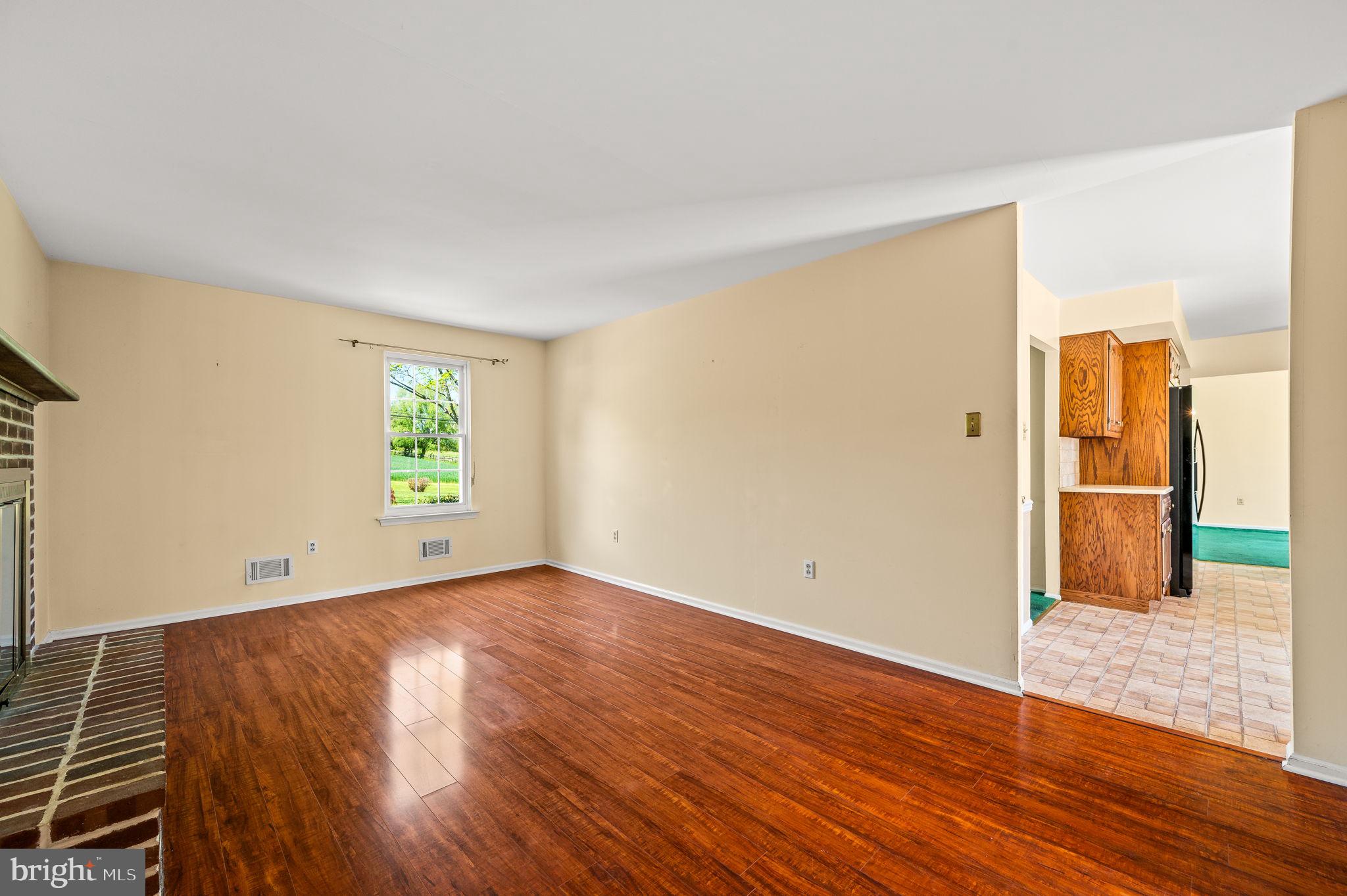 1094 Ebelhare Road Pottstown, PA 19465 - Photo 26 of 45 a view of an empty room with wooden floor and a window