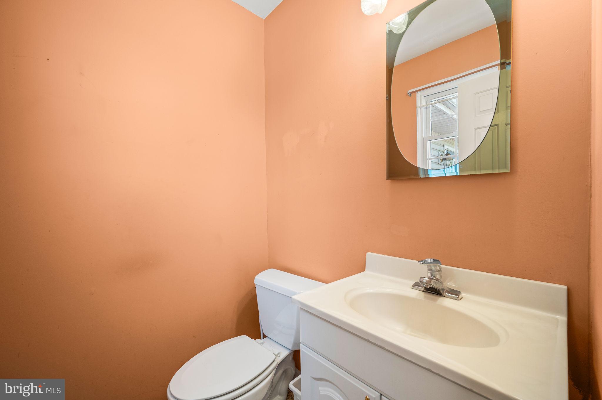 1094 Ebelhare Road Pottstown, PA 19465 - Photo 28 of 45 a bathroom with a toilet a sink and mirror