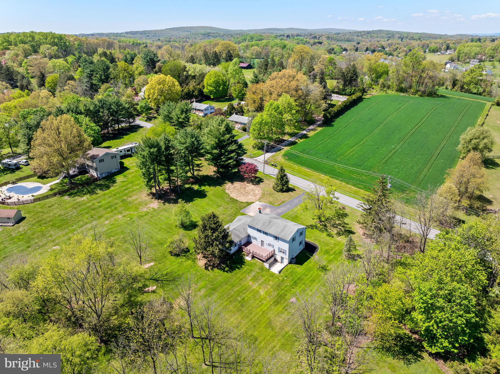 1094 Ebelhare Road Pottstown, PA 19465 - Photo 7 of 45 a view of a lush green forest with a lake