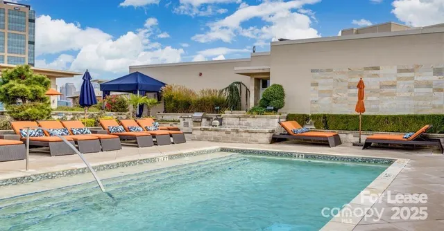 a view of a backyard with table and chairs