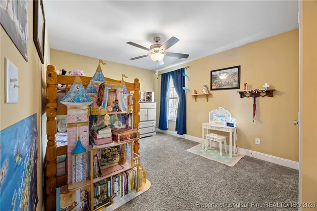 a view of a livingroom with furniture and a flat screen tv