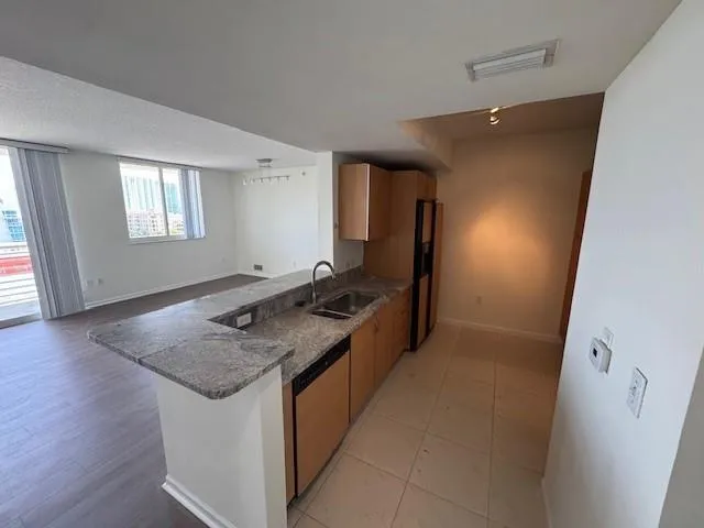 an entryway with wooden floor