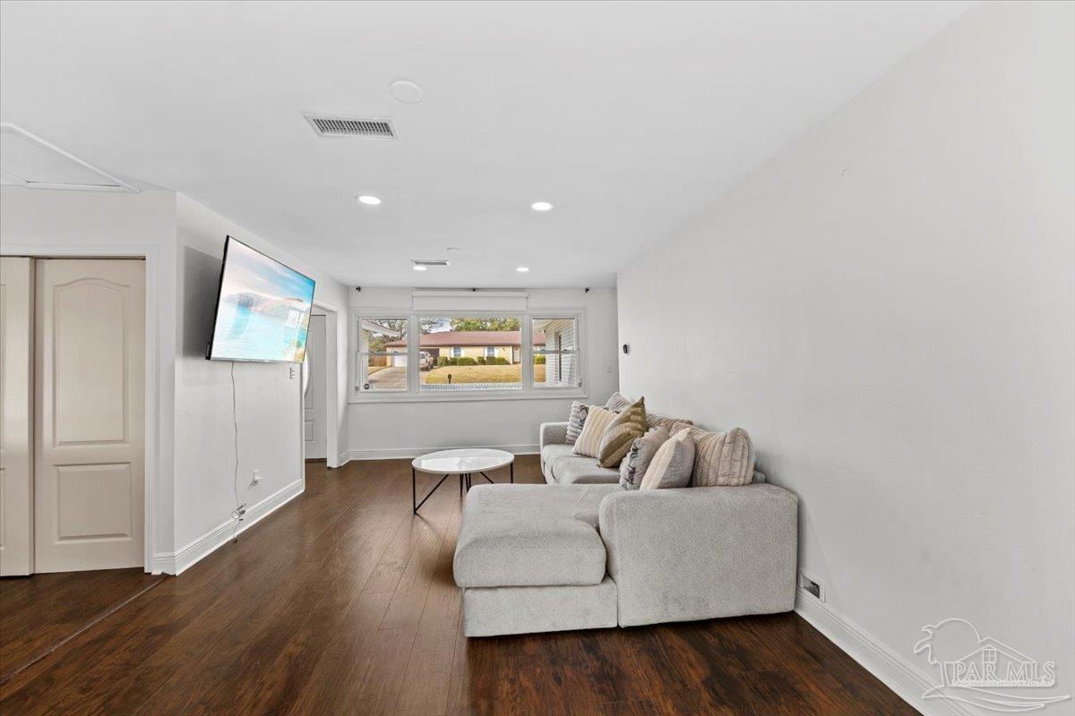 2521 Tomlinson Road Pensacola, FL 32526 - Photo 6 of 30 a living room with furniture and a wooden floor