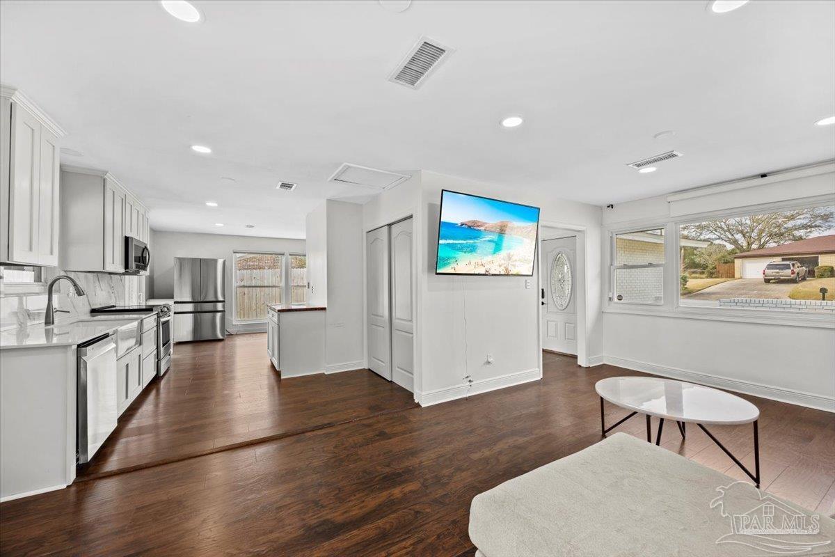 2521 Tomlinson Road Pensacola, FL 32526 - Photo 8 of 30 a view of kitchen with sink and wooden floor