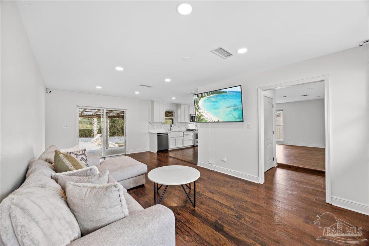 2521 Tomlinson Road Pensacola, FL 32526 - Photo 9 of 30 a living room with furniture and a wooden floor