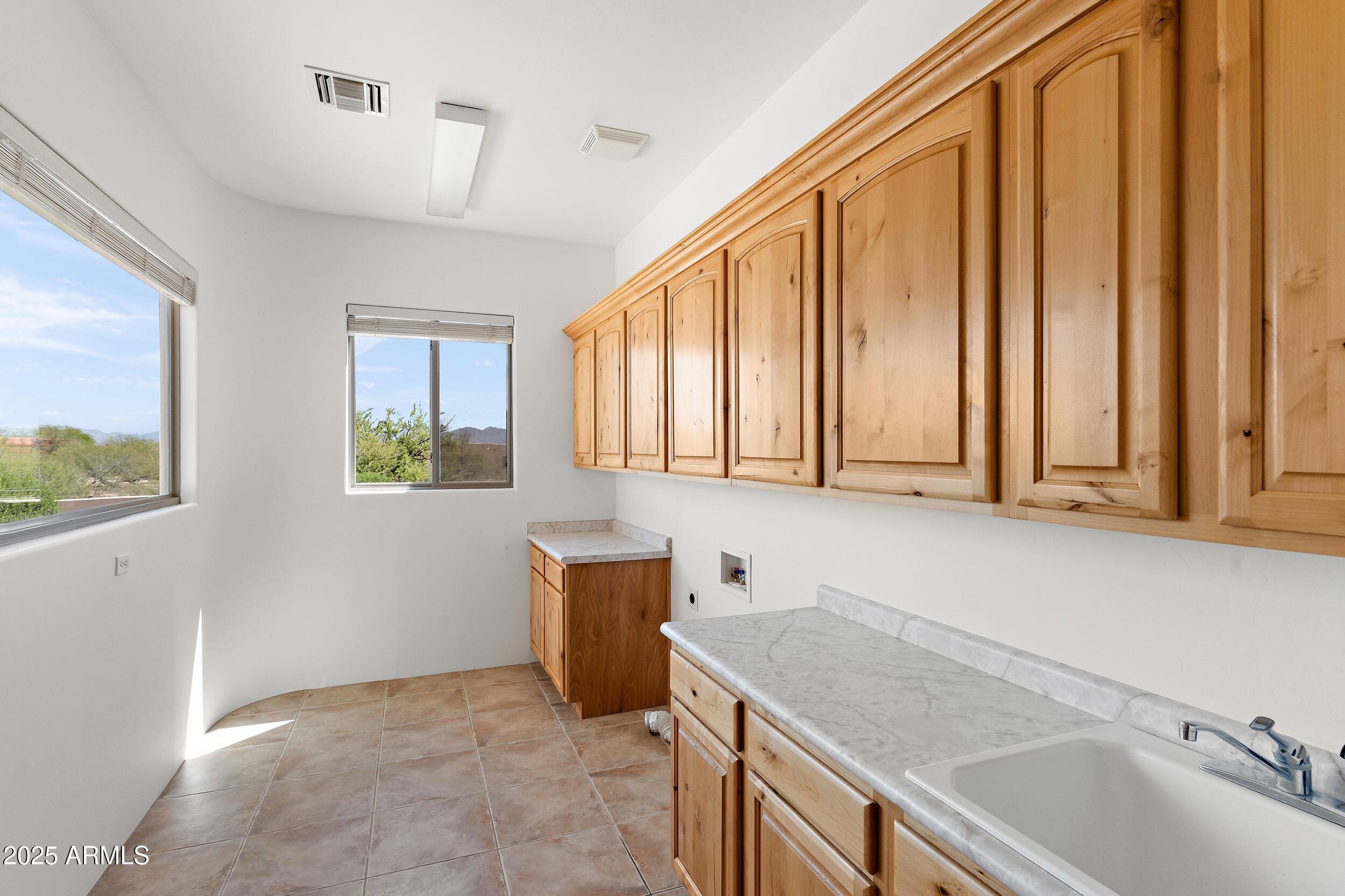 14036 East Ranch Road Scottsdale, AZ 85262 - Photo 11 of 32 a kitchen with a sink cabinets and window