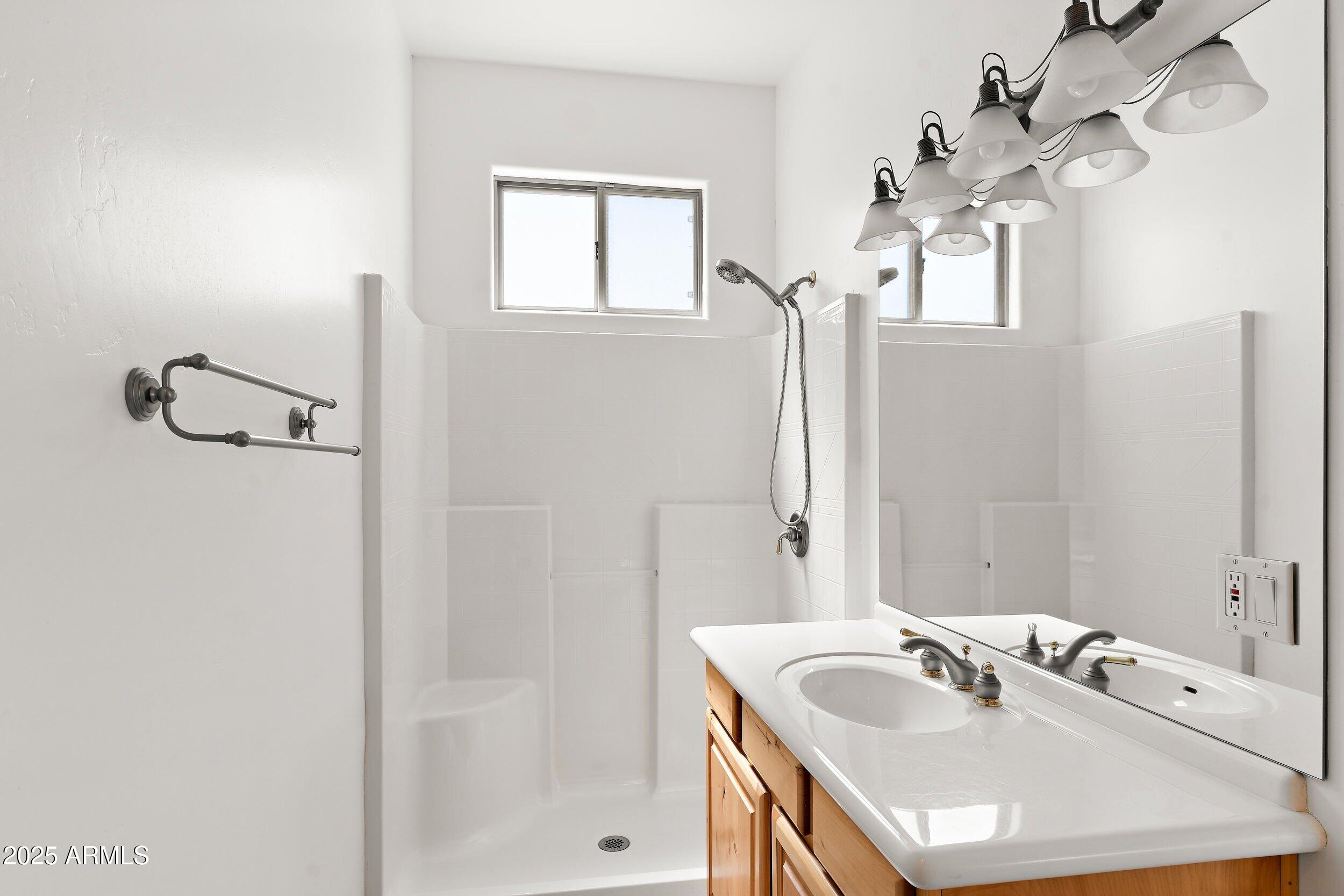 14036 East Ranch Road Scottsdale, AZ 85262 - Photo 13 of 32 a bathroom with a sink and a mirror