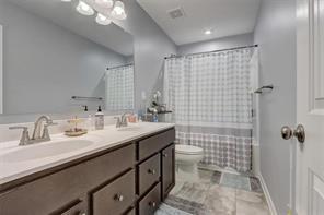 170 Greenbrier Way Canton, GA 30114 - Photo 19 of 34 a bathroom with a double vanity sink toilet and shower