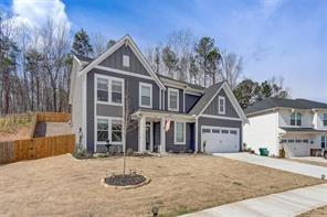 170 Greenbrier Way Canton, GA 30114 - Photo 2 of 34 a front view of a house with a yard and garage