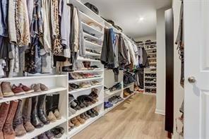 170 Greenbrier Way Canton, GA 30114 - Photo 22 of 34 a view of walk in closet with clothes and shoes