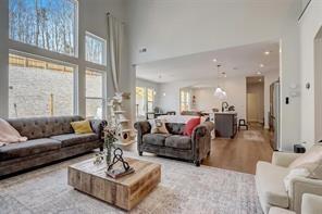 170 Greenbrier Way Canton, GA 30114 - Photo 9 of 34 a living room with furniture wooden floor and a large window