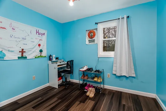 a room with toys and a baby crib