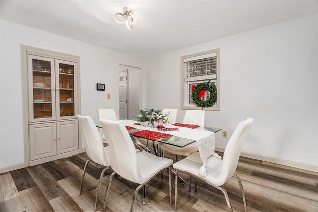 a view of a dining room with furniture and window