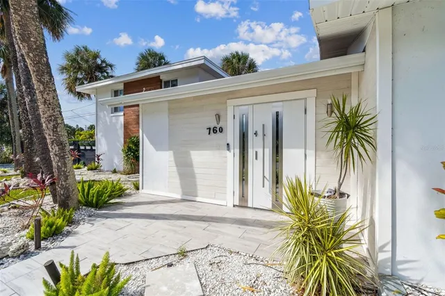 a kitchen with a sink stove and refrigerator