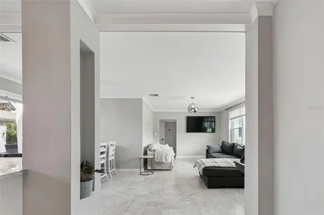 a bedroom with a bed and a large mirror