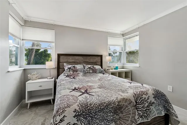 a view of a patio with table and chairs and potted plants