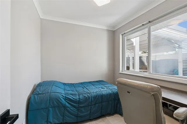 a bathroom with a toilet a sink a mirror a shower and vanity