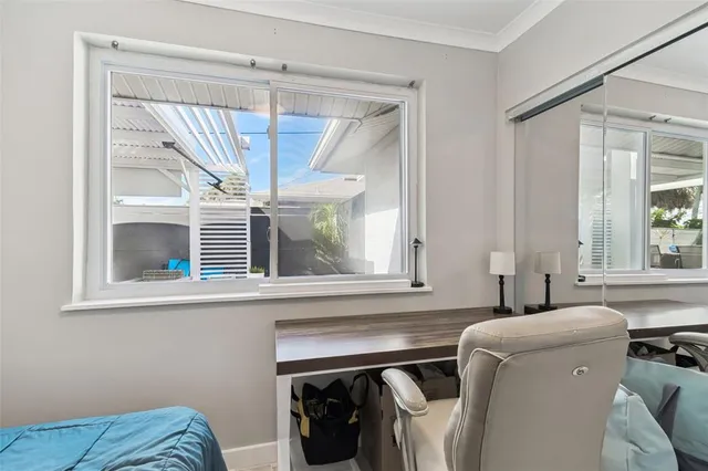 a bathroom with a shower and a window