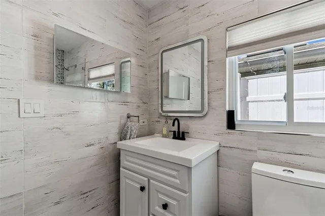 an aerial view of a house with outdoor space