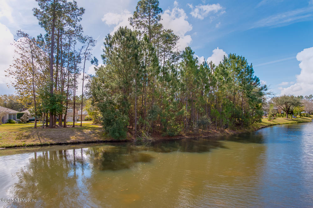 1112 Sandlake Road St. Augustine, FL 32092 - Photo 4 of 16 a view of a lake with trees