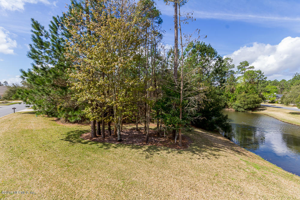 1112 Sandlake Road St. Augustine, FL 32092 - Photo 5 of 16 a backyard of a house with lots of green space