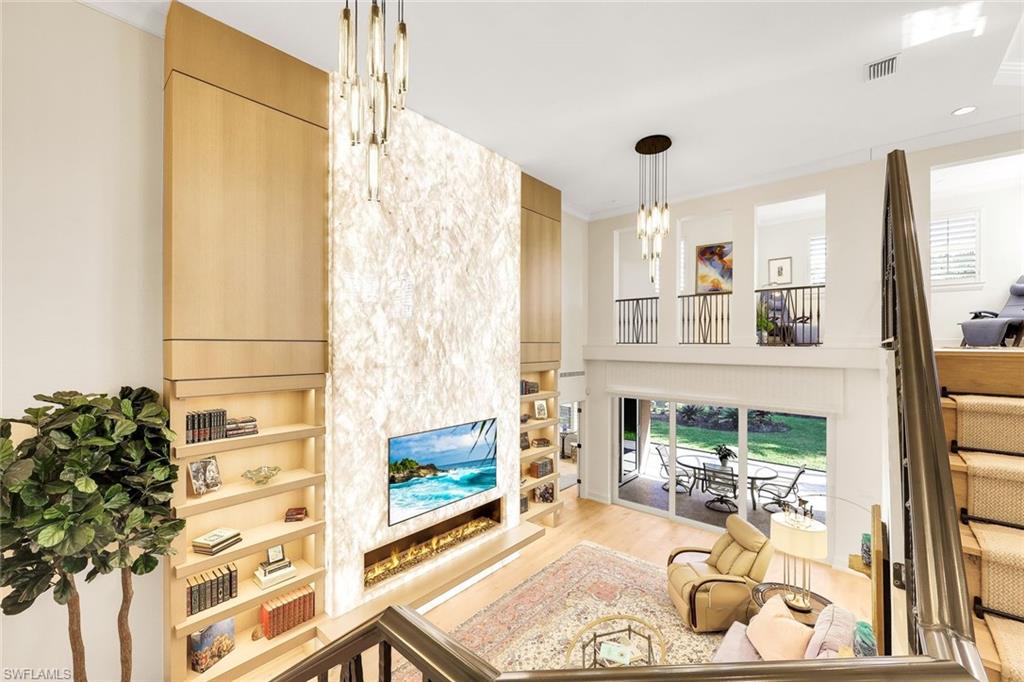 6777 Southern Oak Court Naples, FL 34109 - Photo 1 of 49 A must see Sand Dollar Award-Winning Masterpiece!