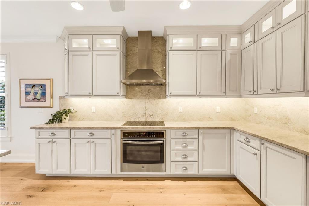 6777 Southern Oak Court Naples, FL 34109 - Photo 8 of 49 Elegant Taj Mahal Quartz w/ matching counter splash