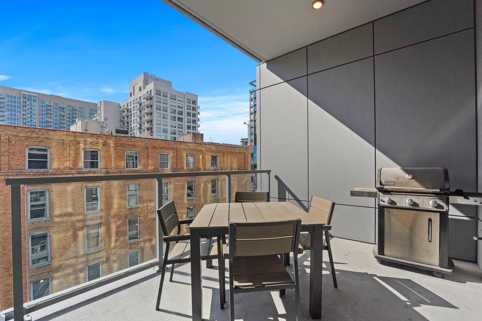 360 West Erie Street, Unit 5A Chicago, IL 60654 - Photo 25 of 32 a view of a chairs and table in the balcony