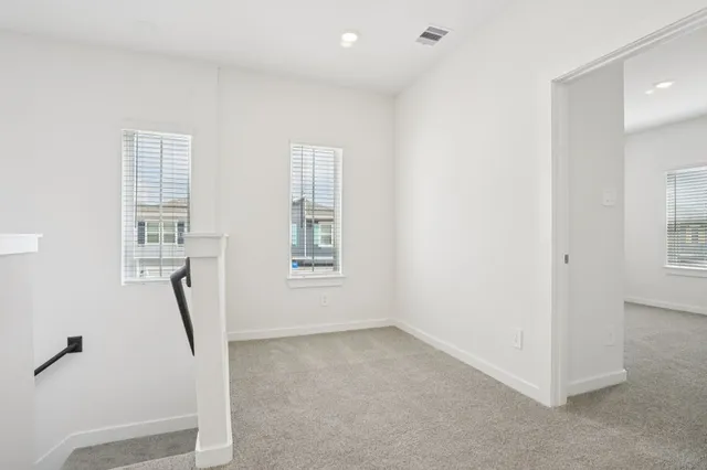 a view of room with window and stairs
