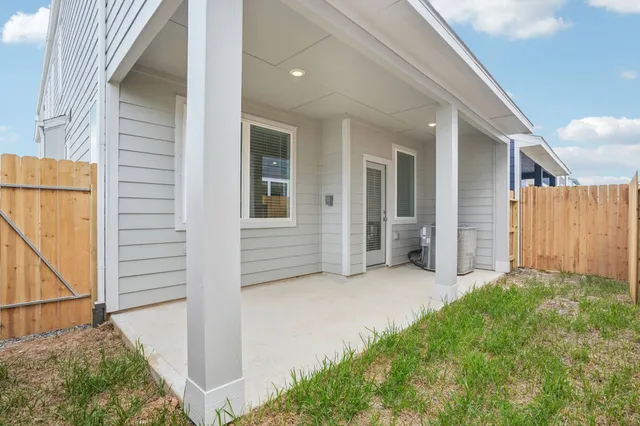 a view of a house with a garage and balcony