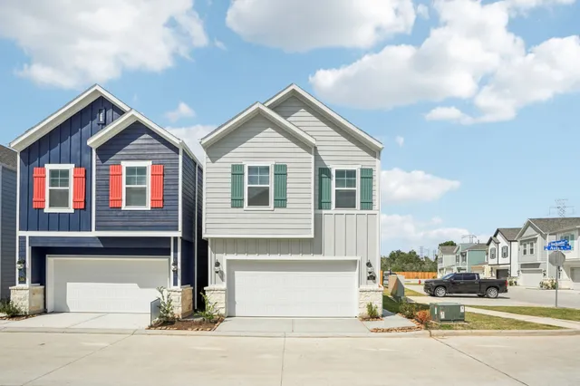 a front view of residential houses with street