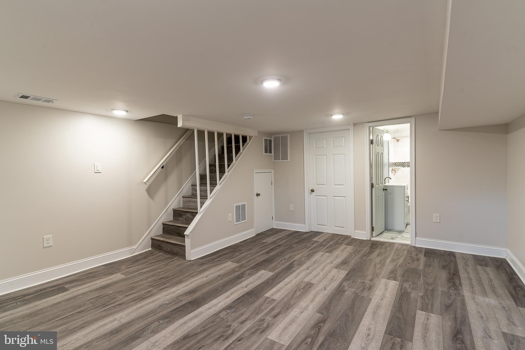 407 Old Riverside Road Baltimore, MD 21225 - Photo 14 of 27 Spacious, versatile basement retreat awaits.