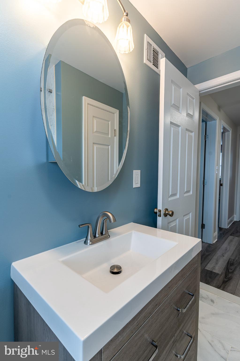 407 Old Riverside Road Baltimore, MD 21225 - Photo 20 of 27 Sleek bathroom with modern elegance.