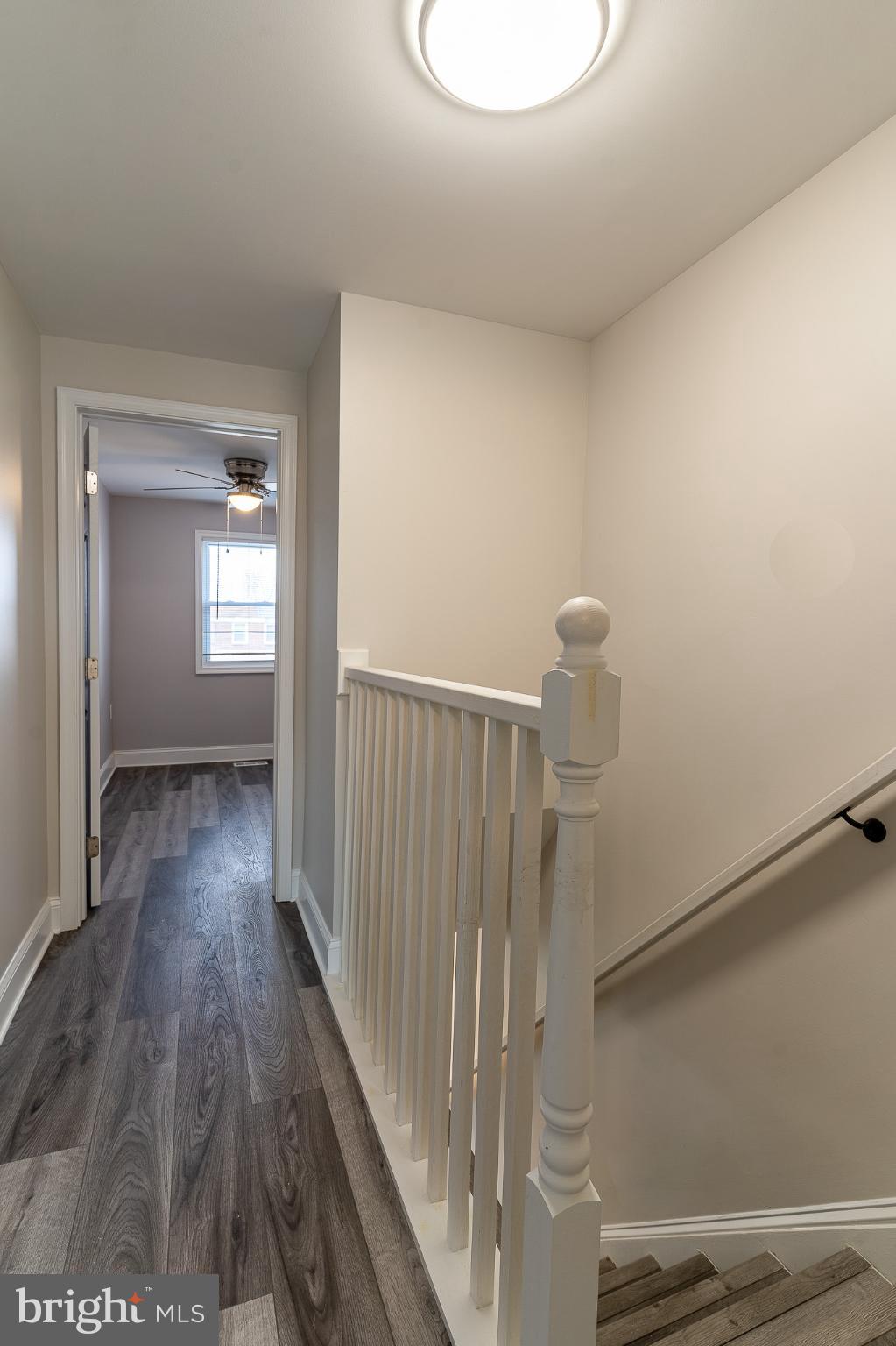 407 Old Riverside Road Baltimore, MD 21225 - Photo 21 of 27 Bright and inviting staircase to upper levels.