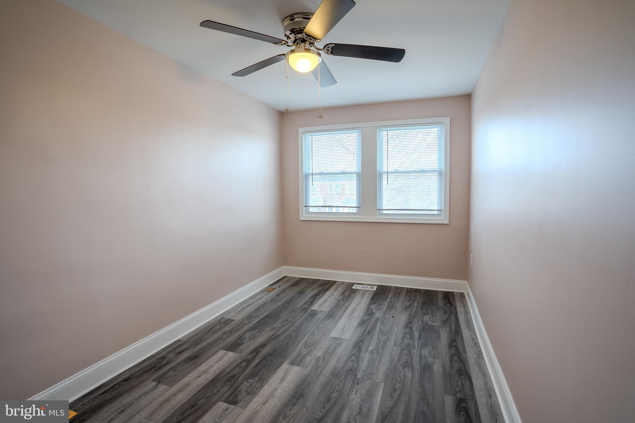 407 Old Riverside Road Baltimore, MD 21225 - Photo 22 of 27 Bright and airy room with modern finishes.