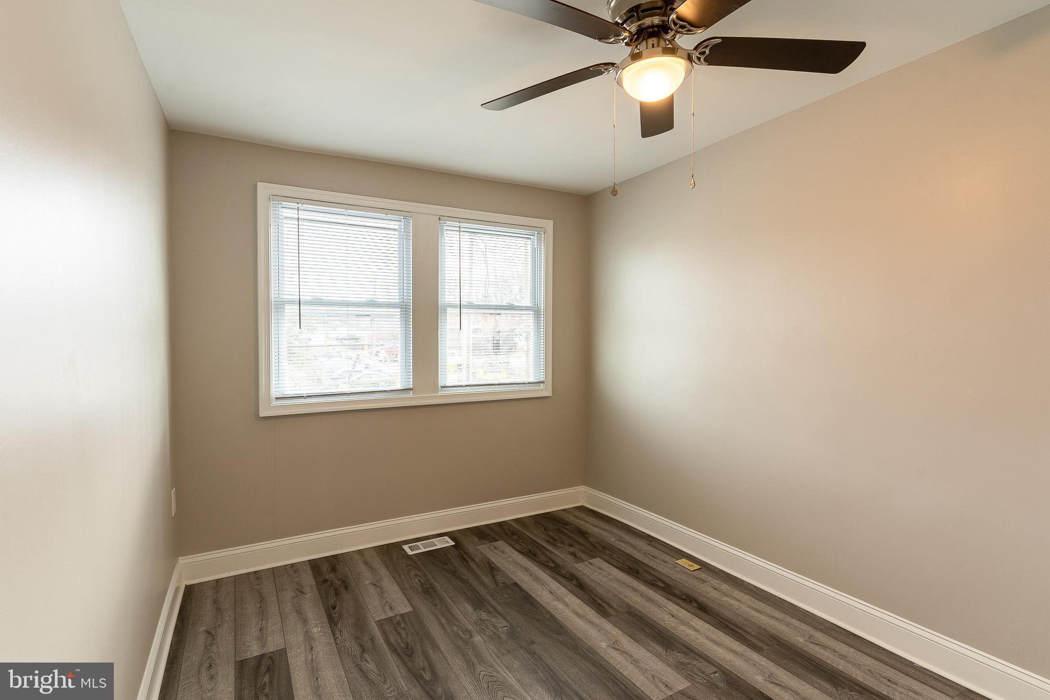 407 Old Riverside Road Baltimore, MD 21225 - Photo 24 of 27 Bright and airy room with modern finishes.