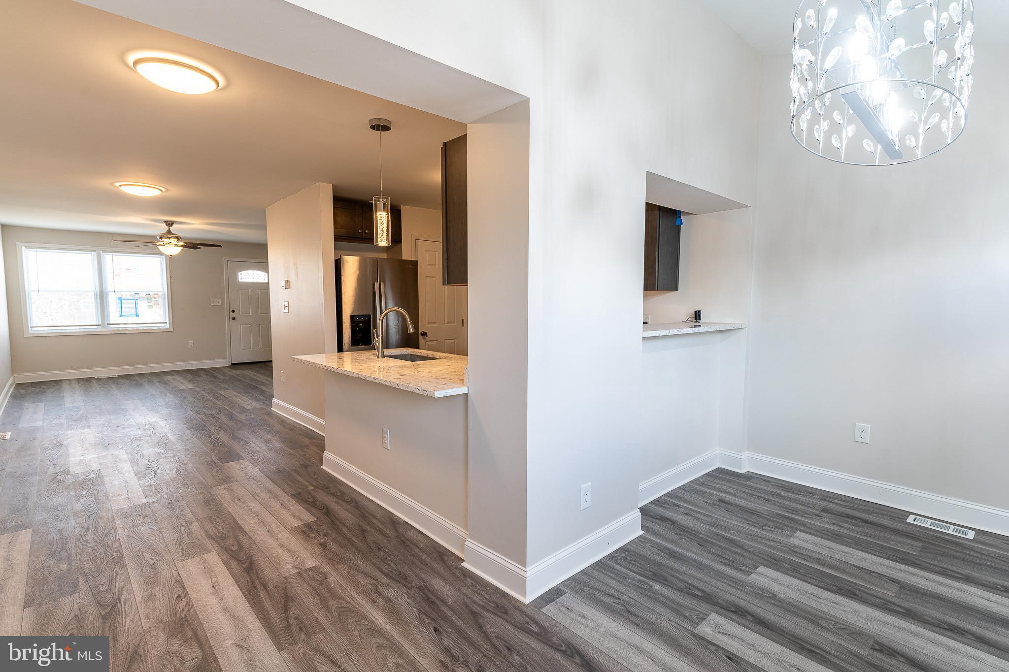 407 Old Riverside Road Baltimore, MD 21225 - Photo 7 of 27 Modern open-concept living space awaits you.