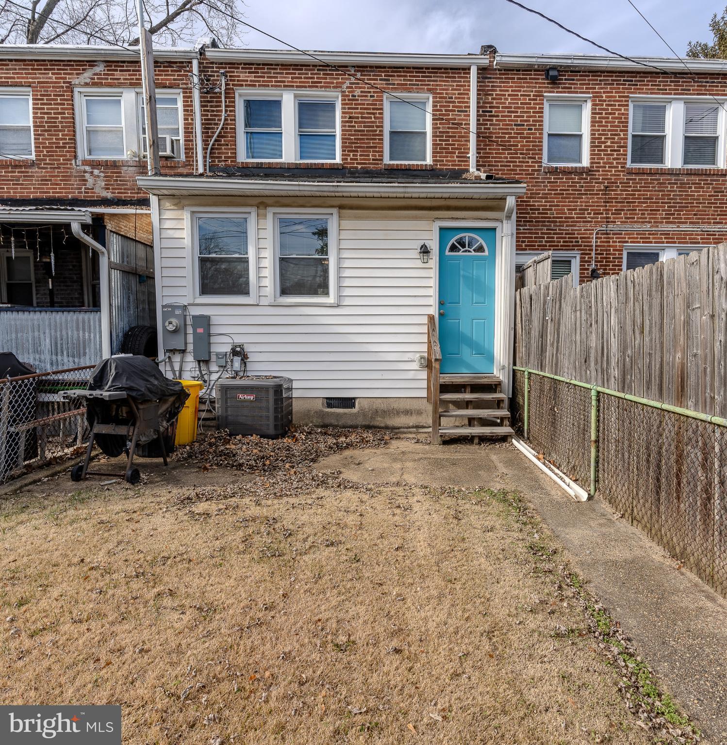 407 Old Riverside Road Baltimore, MD 21225 - Photo 10 of 27 Charming backyard with a pop of color.