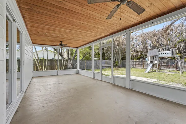 a view of a porch with wooden floor and roof