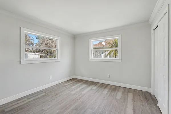 a view of room with wooden floor and window