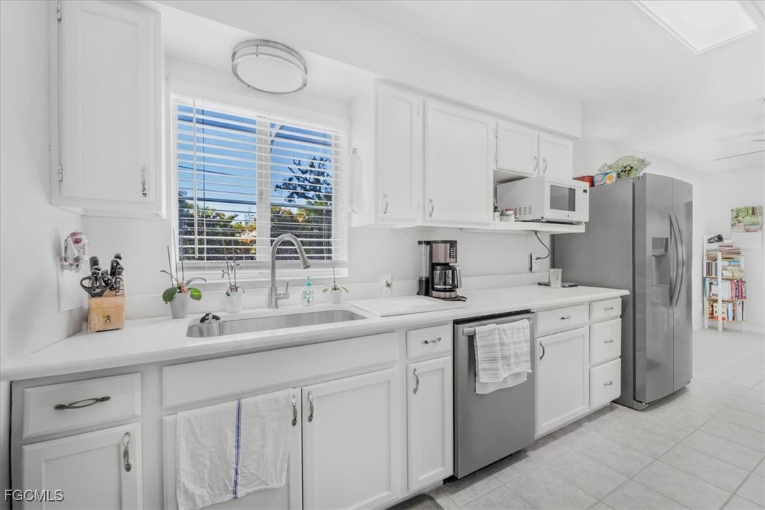 13239 Caribbean Boulevard Fort Myers, FL 33905 - Photo 11 of 37 a kitchen with a sink cabinets and window