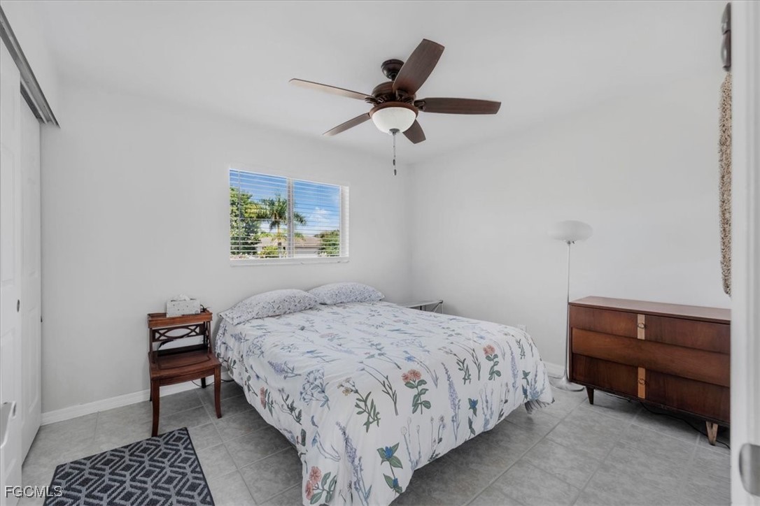 13239 Caribbean Boulevard Fort Myers, FL 33905 - Photo 16 of 37 a bedroom with a bed and a dresser