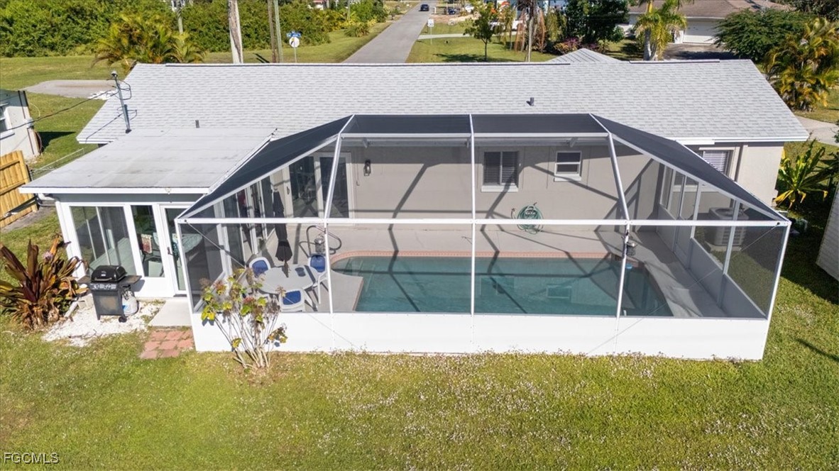 13239 Caribbean Boulevard Fort Myers, FL 33905 - Photo 2 of 37 a view of house with swimming pool