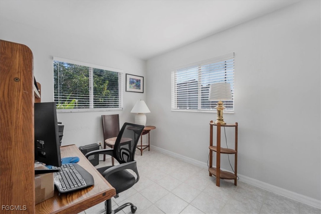 13239 Caribbean Boulevard Fort Myers, FL 33905 - Photo 21 of 37 a workspace with furniture and a window