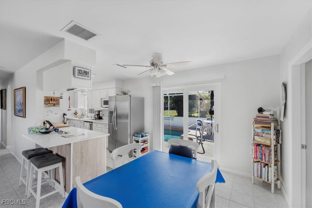 13239 Caribbean Boulevard Fort Myers, FL 33905 - Photo 24 of 37 a living room with furniture and a wooden floor