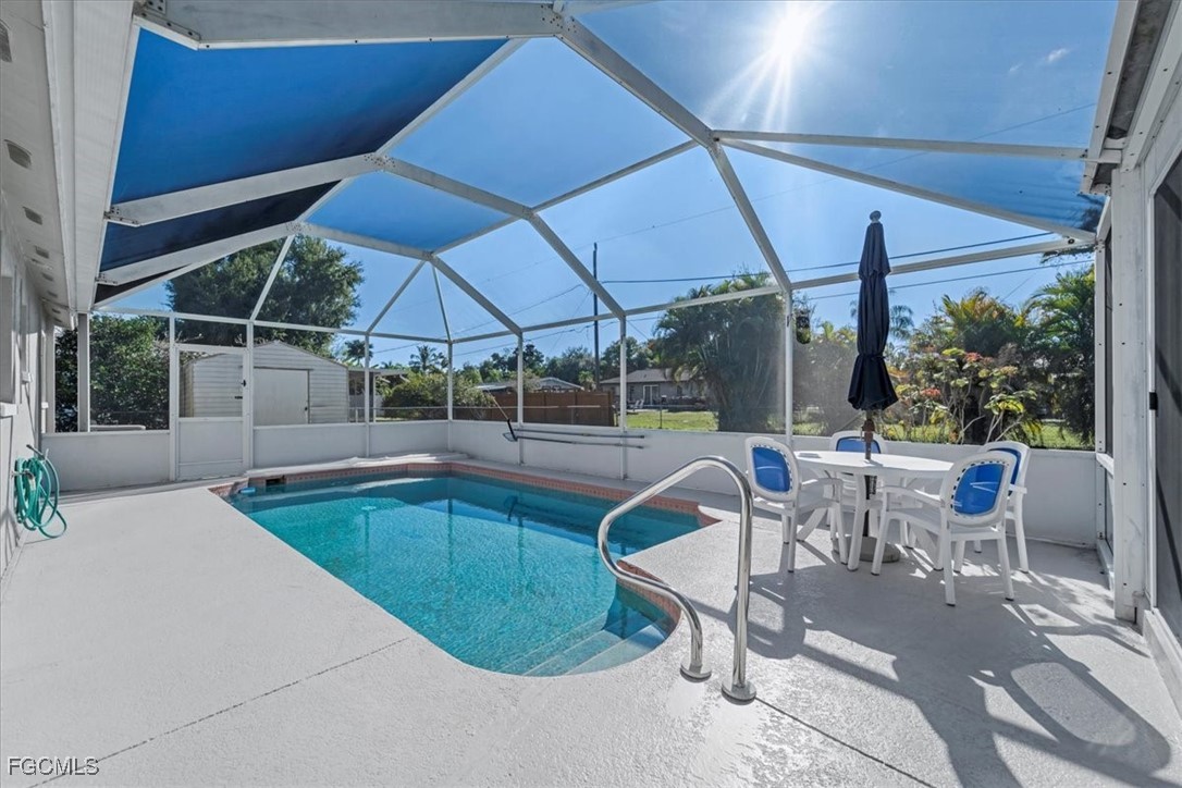13239 Caribbean Boulevard Fort Myers, FL 33905 - Photo 29 of 37 a view of a swimming pool with a patio