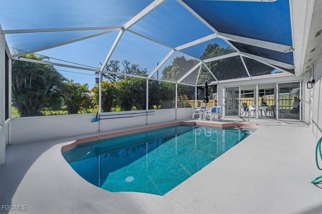 13239 Caribbean Boulevard Fort Myers, FL 33905 - Photo 30 of 37 a view of a swimming pool with a patio