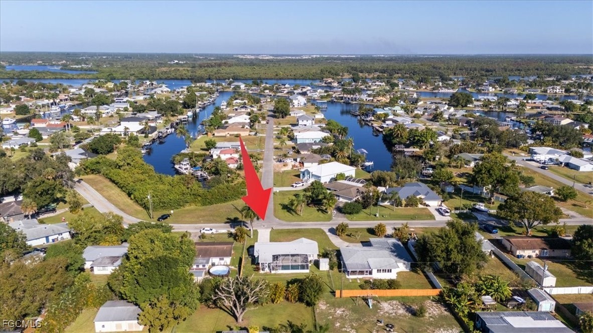 13239 Caribbean Boulevard Fort Myers, FL 33905 - Photo 36 of 37 an aerial view of residential building and parking space