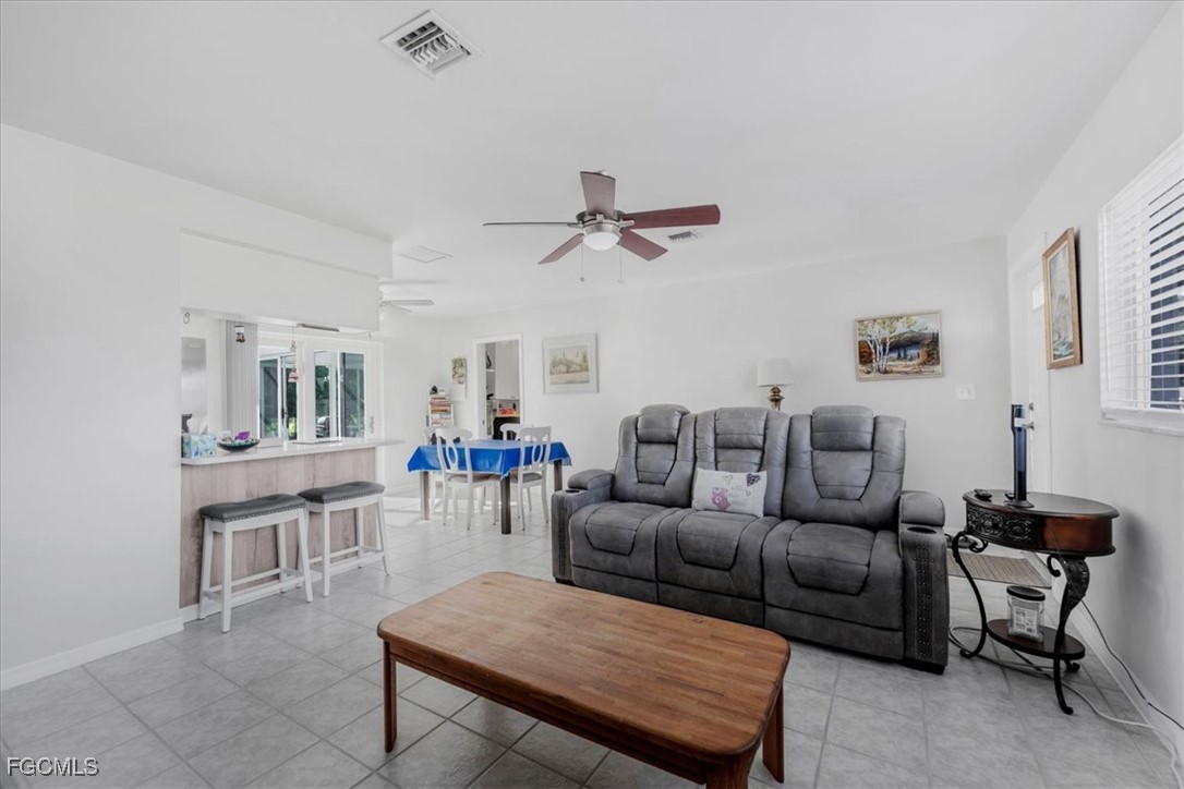 13239 Caribbean Boulevard Fort Myers, FL 33905 - Photo 7 of 37 a living room with furniture and a table