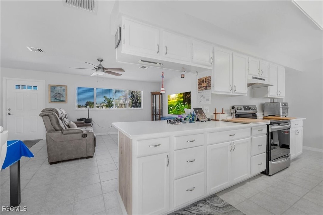 13239 Caribbean Boulevard Fort Myers, FL 33905 - Photo 10 of 37 a kitchen with cabinets window and appliances